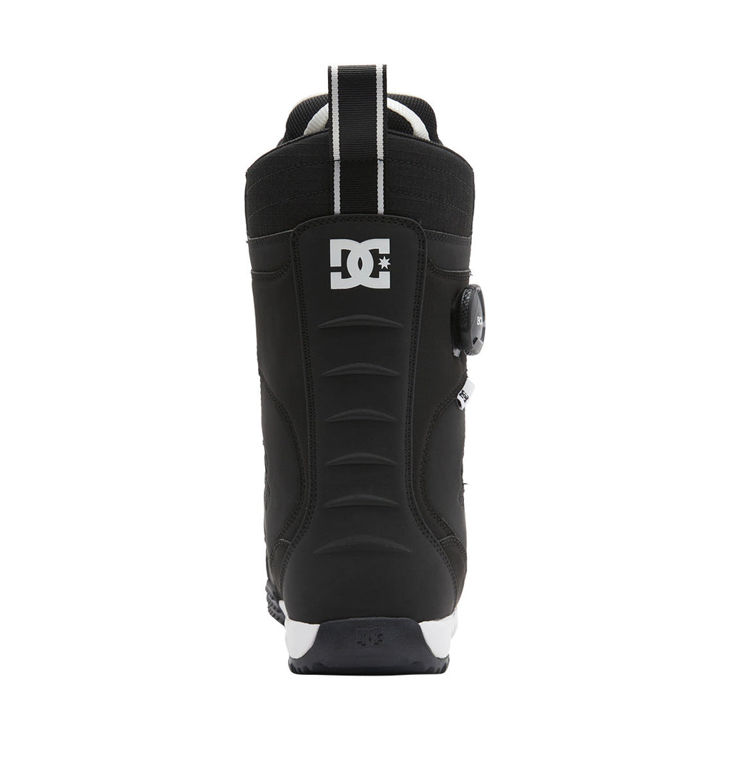 A rear view of the Men’s Premier Hybrid BOA® Snowboard Boot by DC Shoes in black, showcasing the DC logo near the top, a pull loop on the heel, and a textured vertical design. The boot features the BOA® Fit System, with its signature dial visible on the side.