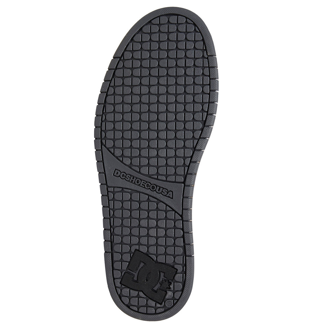 Featuring a black sole with a textured grid pattern, the Men’s Court Graffik Shoes by DC Shoes showcase “DC SHOE CO USA” text in the arch area and a bold DC logo near the heel. The sole’s rounded edges and gently curved shape perfectly complement the signature puffy silhouette of this iconic style.