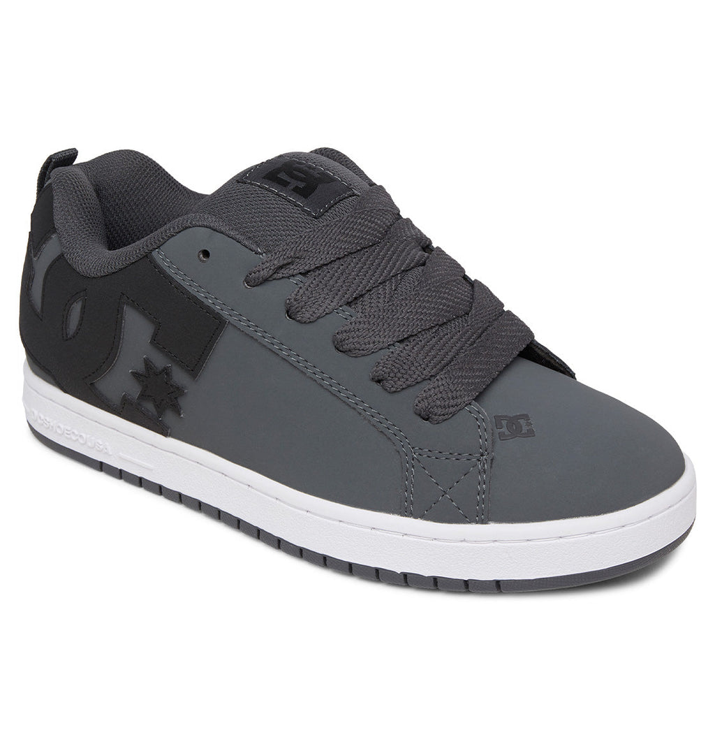 A gray and black men’s sneaker from DC Shoes, the Court Graffik features a puffy silhouette, thick black laces, a white sole, and signature DC branding on the side and tongue—showcasing classic elements of this iconic skate-inspired line.