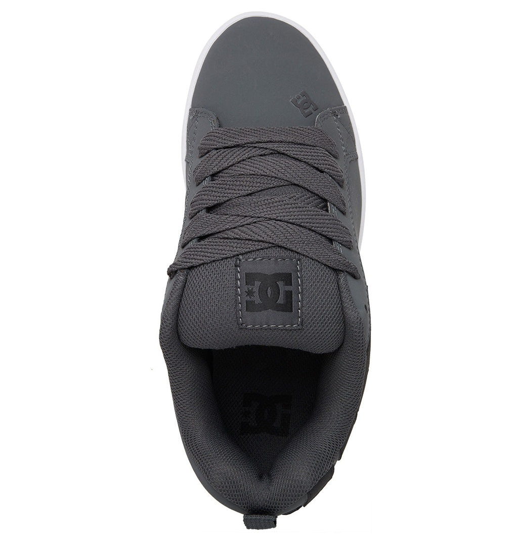 The Men’s Court Graffik Shoes by DC Shoes are shown from above against a white background, featuring a gray upper with dark gray laces, a padded collar, and the signature puffy silhouette. A black DC logo appears on the tongue.