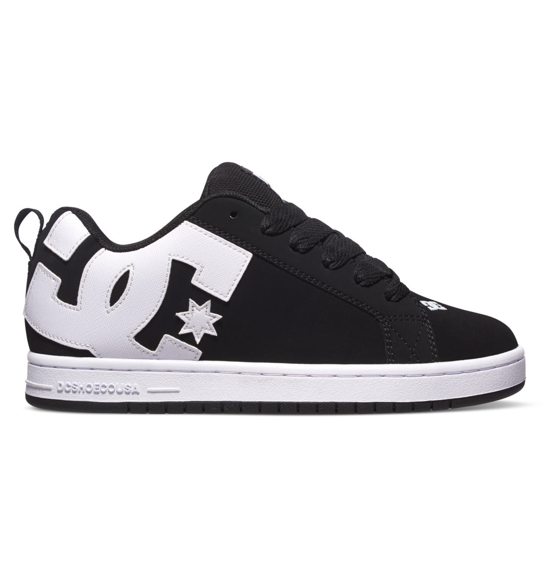 The Men’s Court Graffik Shoes by DC Shoes feature a black and white color scheme with a prominent white DC logo on the side, black laces, and a contrasting white sole. This low-top skate shoe displays the classic puffy silhouette and distinctive branding near the heel and toe.
