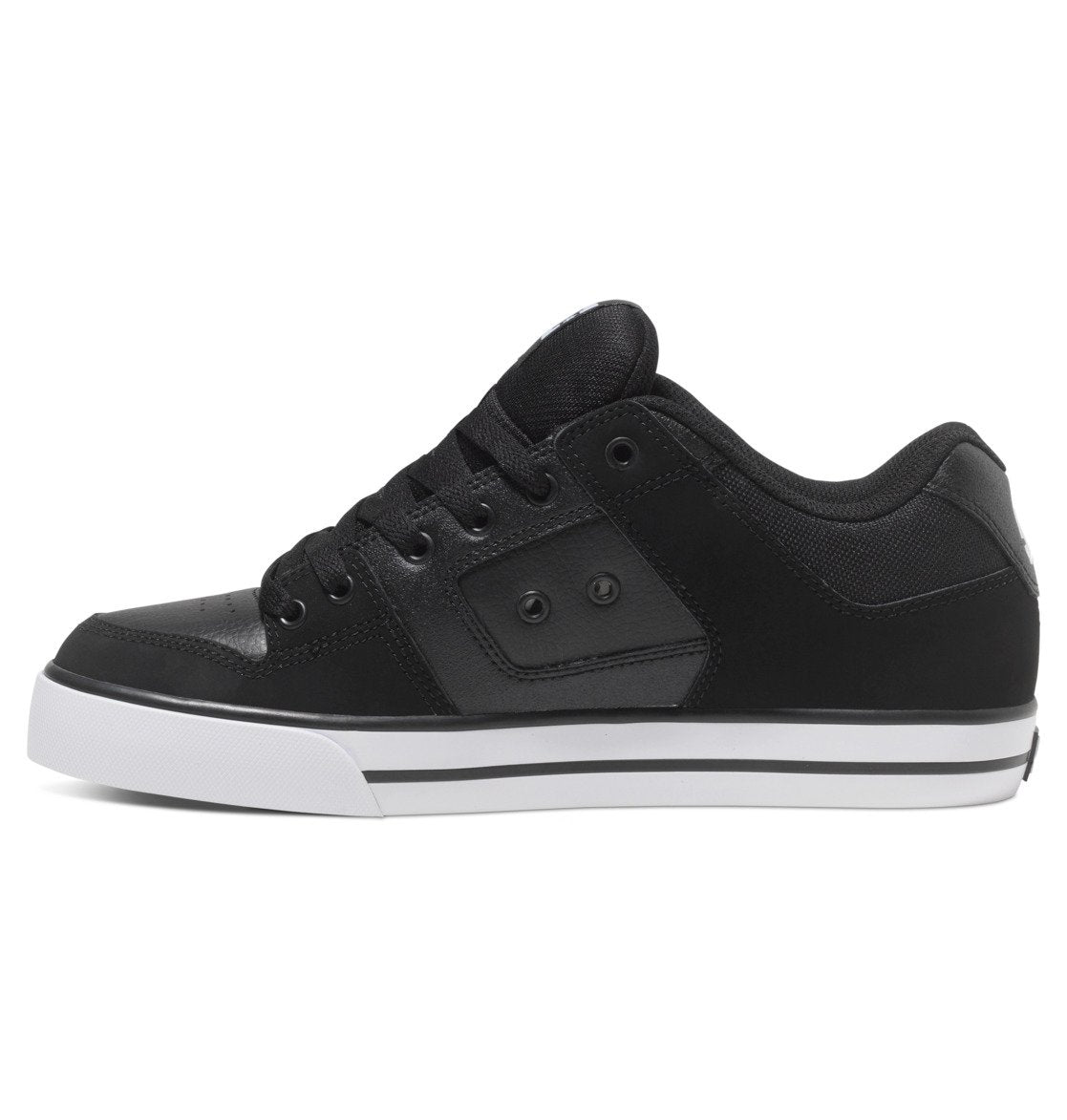 A side view of the DC Shoes Men’s Pure Shoes in black, featuring a white sole, black laces, subtle stitching details, and metal eyelets. This versatile sneaker is ideal for both casual and smart-casual men’s outfits.