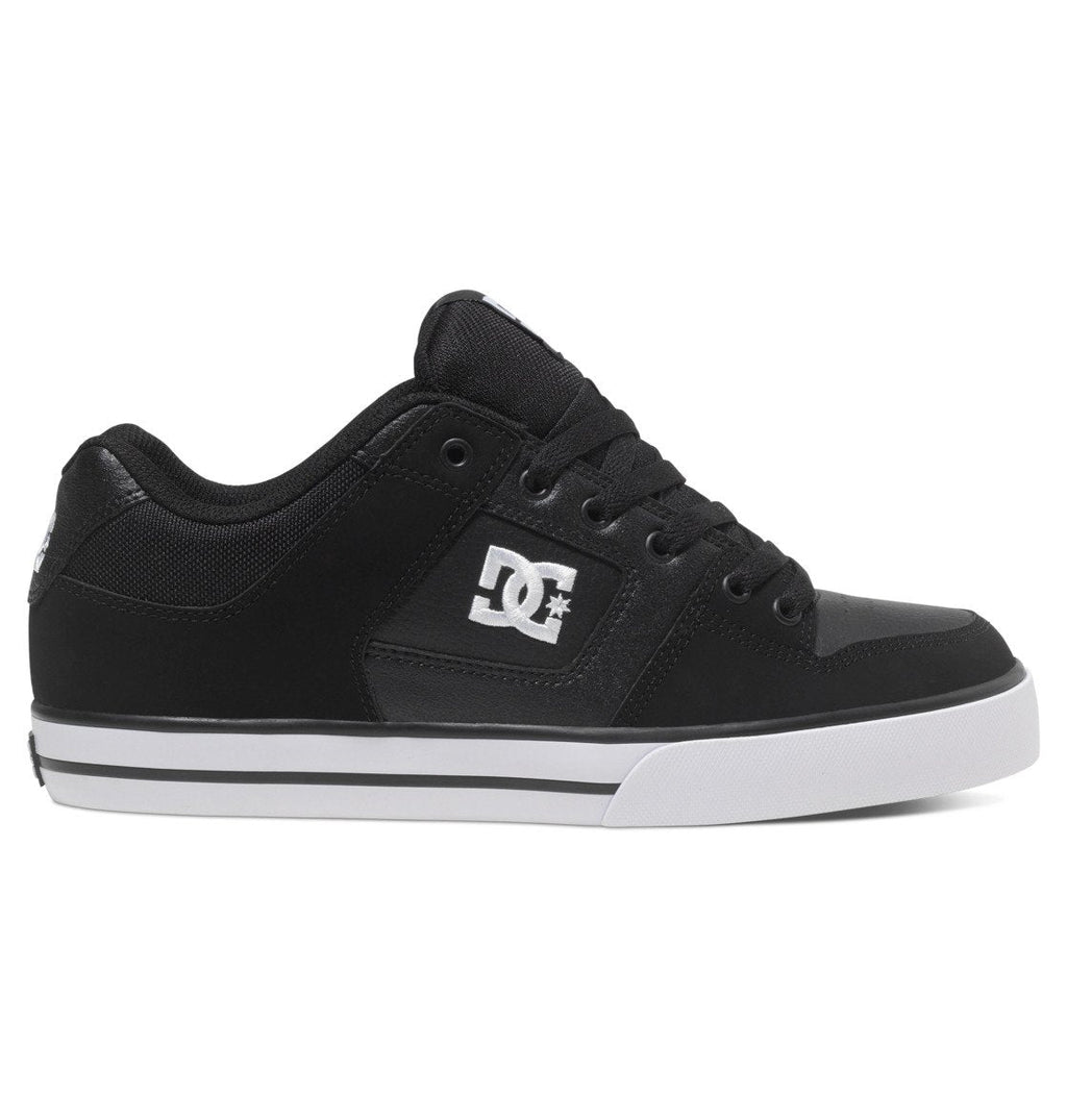 A left-profile view of the DC Shoes Men’s Pure Shoes in black features black laces, a white sole, and the DC logo in white on the side against a white background—these versatile and comfortable shoes are a popular choice for men.