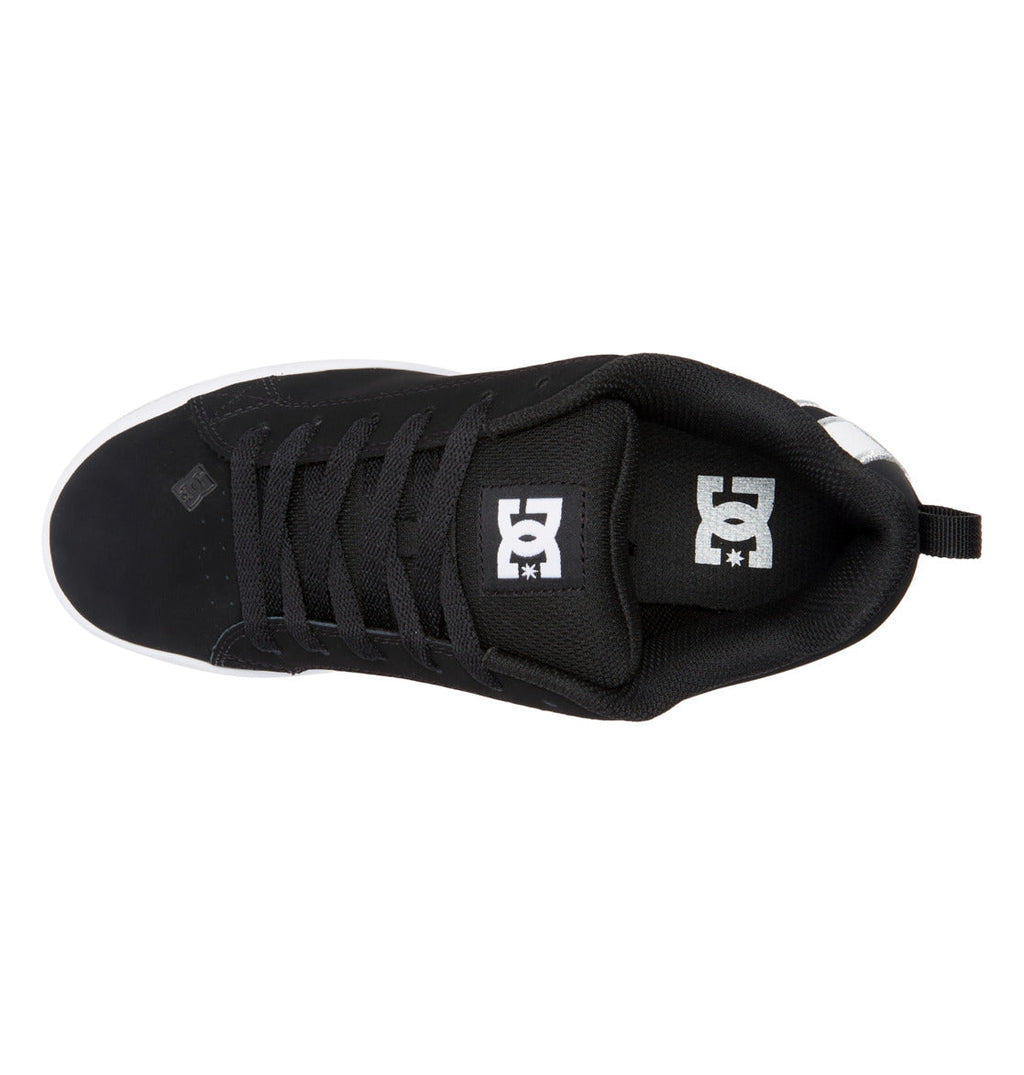 Top view of the Women’s Court Graffik Shoes by DC Shoes, featuring a black chunky design with black laces and a white DC Shoes logo on the padded tongue, capturing that iconic ’90s style against a white background.