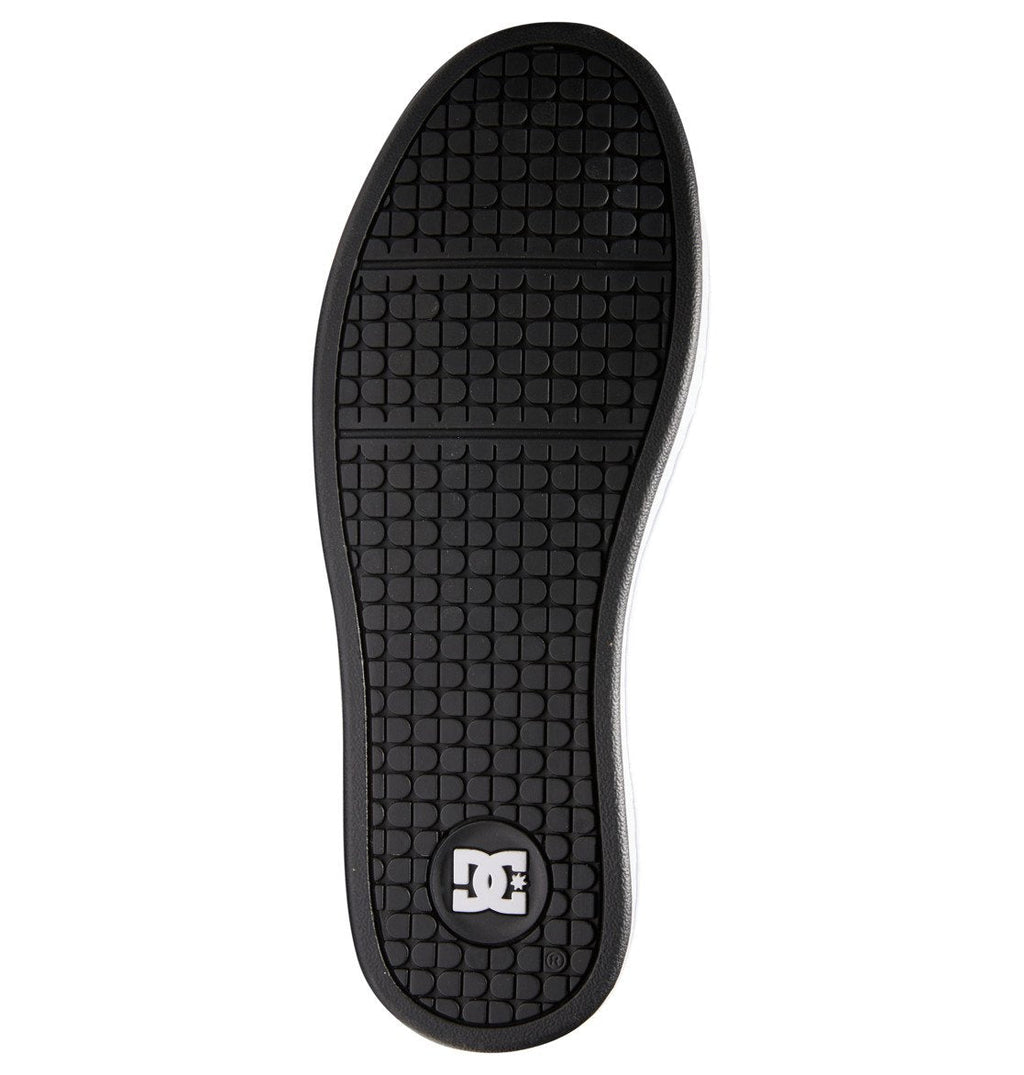 Bottom view of the Men’s Net Shoes by DC Shoes, featuring a black rubber sole with a grid tread pattern and prominent DC branding at the heel, crafted from durable materials for long-lasting wear.
