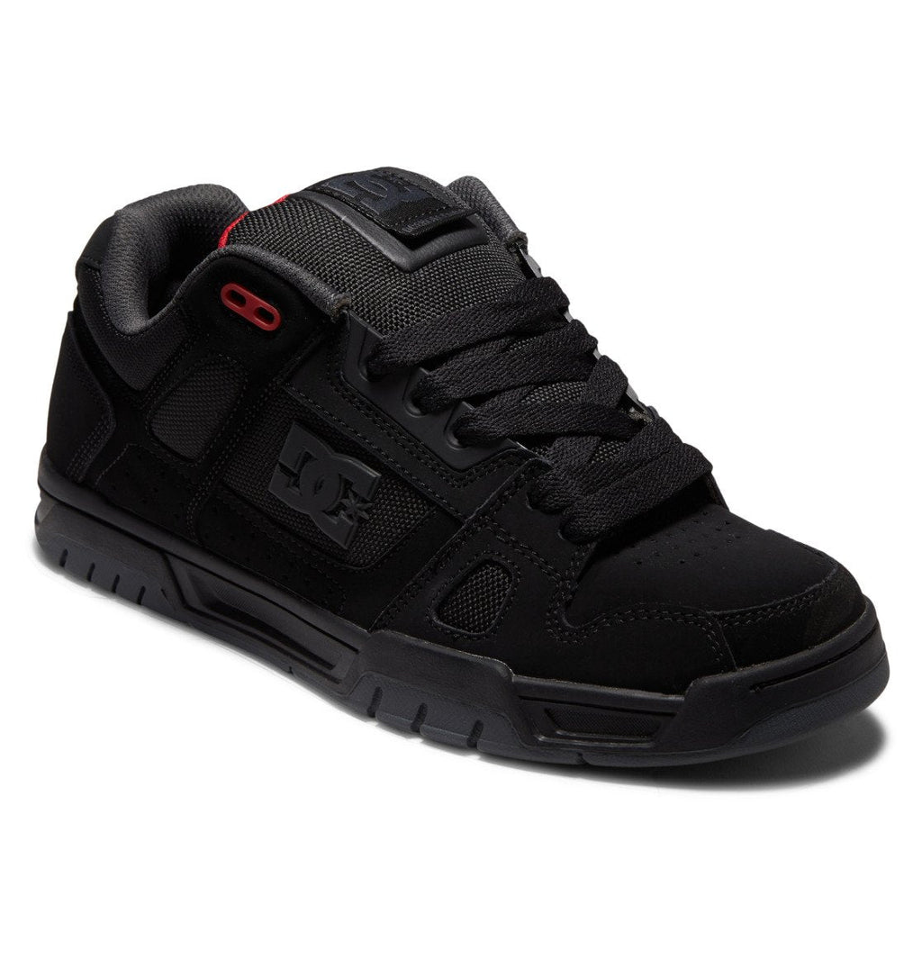The DC Shoes Men’s Stag Shoes feature a sleek black design with durable cupsole construction, mesh and suede detailing, black laces, and subtle red accents near the top eyelets for a technically-inspired look.