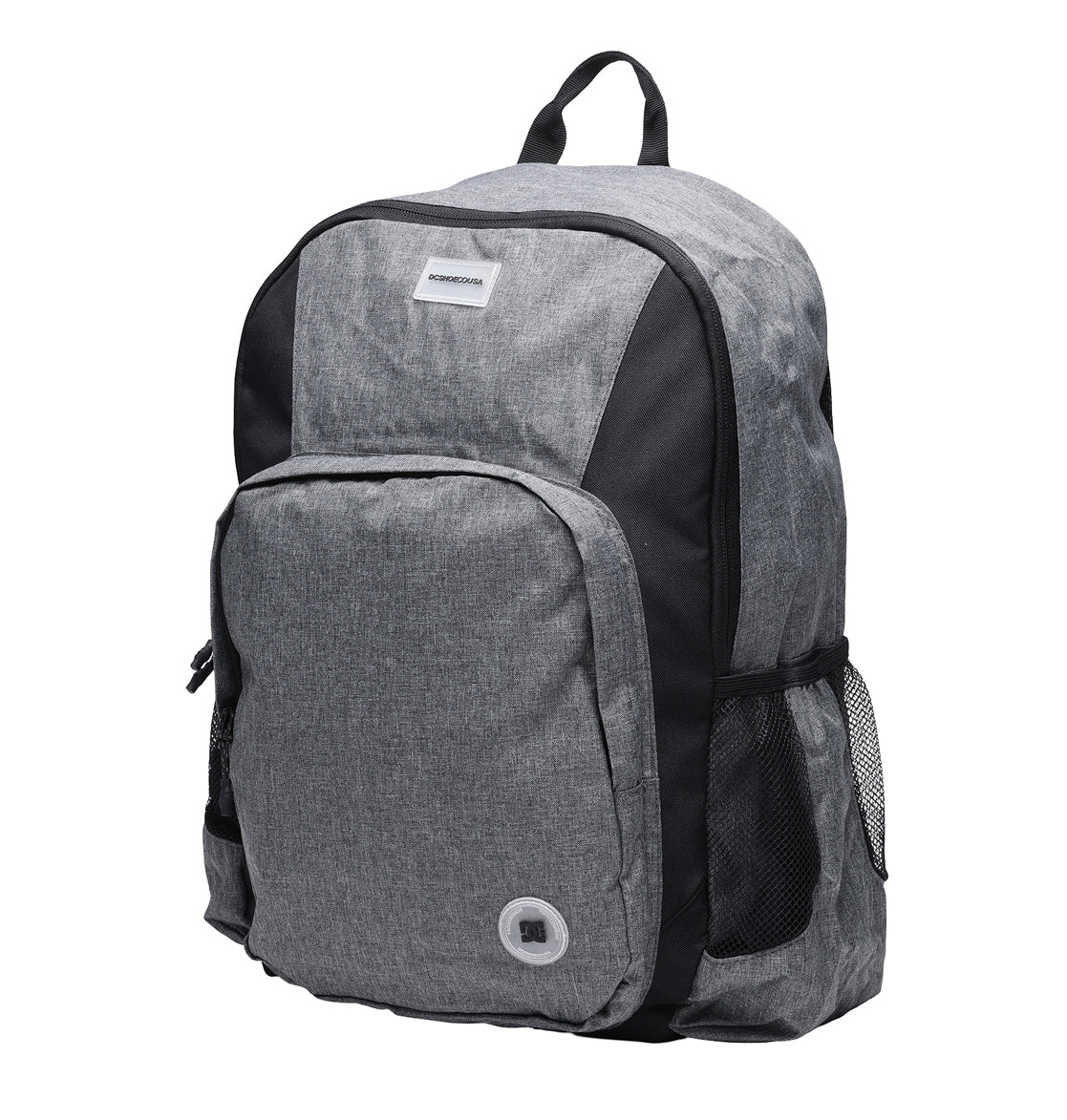 The DC Shoes Locker Backpack is gray and black, featuring a spacious front pocket, mesh side pockets, a top handle, a small round grommet on the front, and a padded laptop sleeve for added protection.