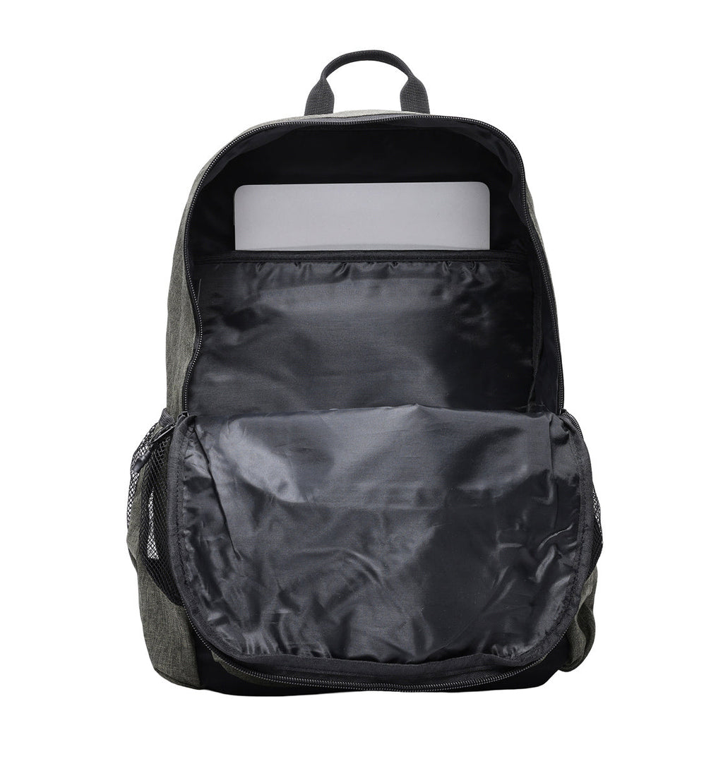 A dark gray DC Shoes Locker Backpack with its front unzipped and open, revealing an inner compartment that holds a silver laptop in a padded sleeve. The backpack features mesh pockets on the sides.