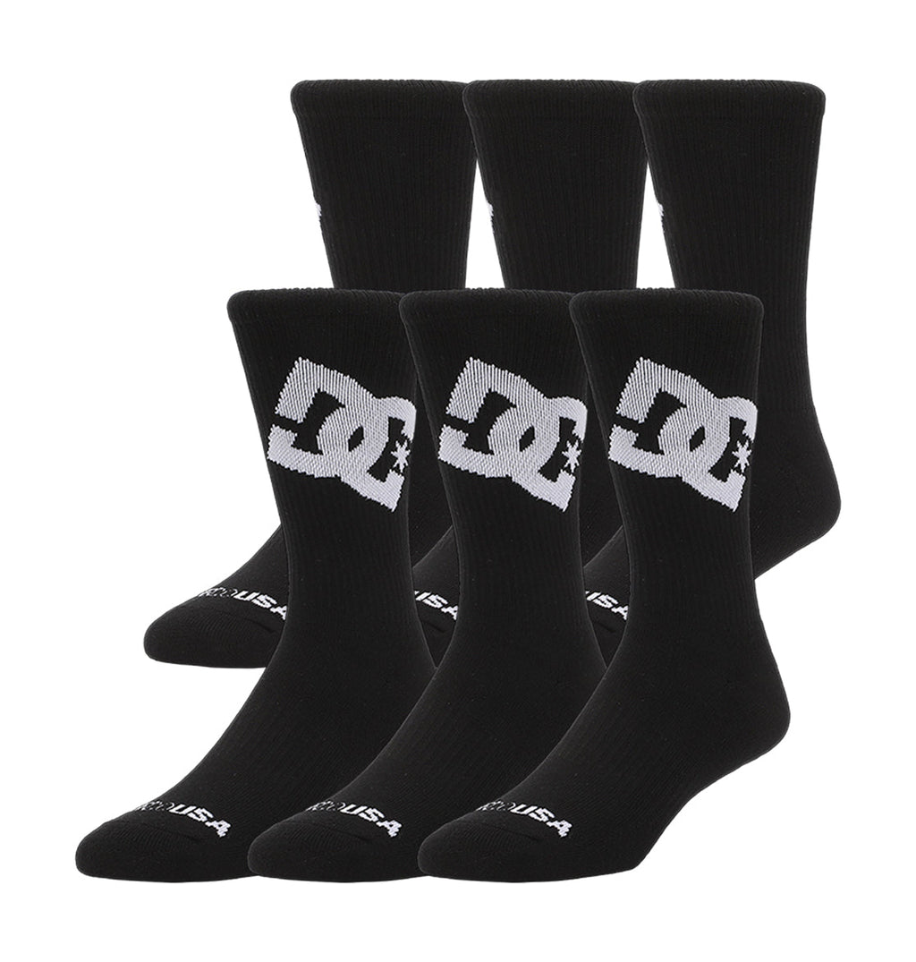 Two rows of DC Shoes Graffik Logo Crew Socks 3-Pack (black with large white DC logo and star), totaling six pairs.