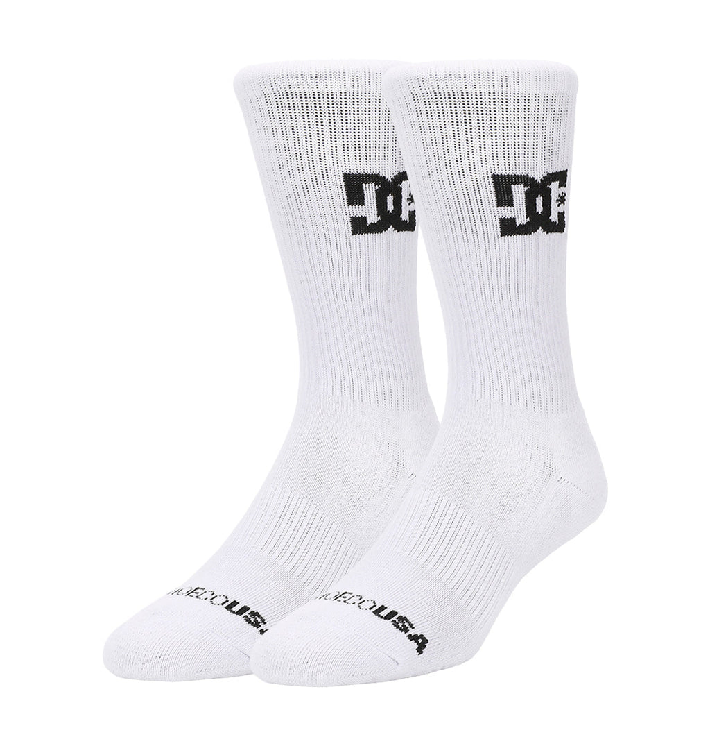 The DC Shoes Crew Socks 6-Pack features white crew socks with a black DC Shoes logo near the top and "DC SHOES USA" in black on the toes, all displayed upright against a plain white background.