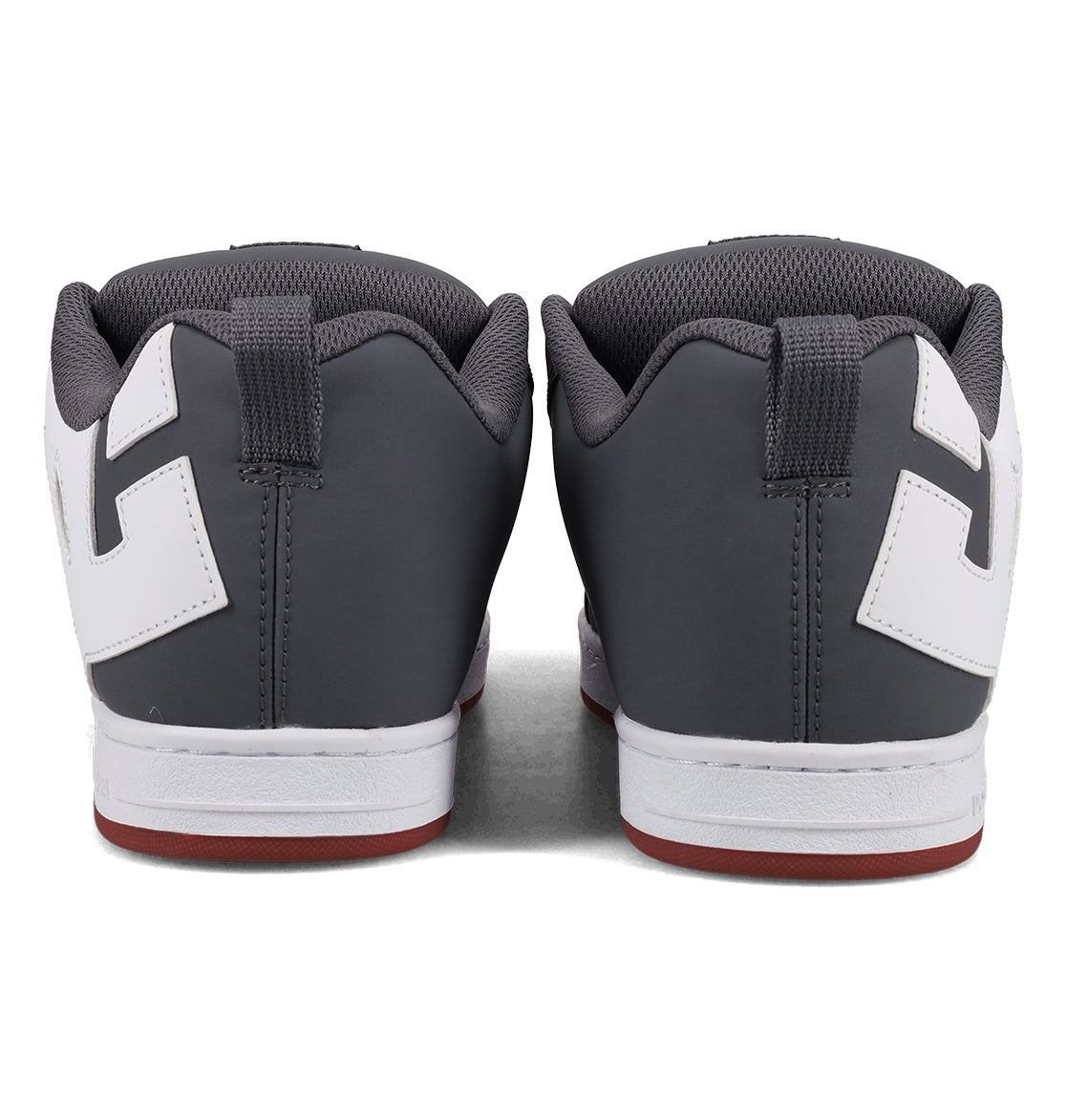 Back view of a pair of Men’s Court Graffik Shoes by DC Shoes in gray, featuring white accents, white midsoles, and red outsoles. The sneakers are placed side by side on a plain surface, highlighting their signature chunky skate style.