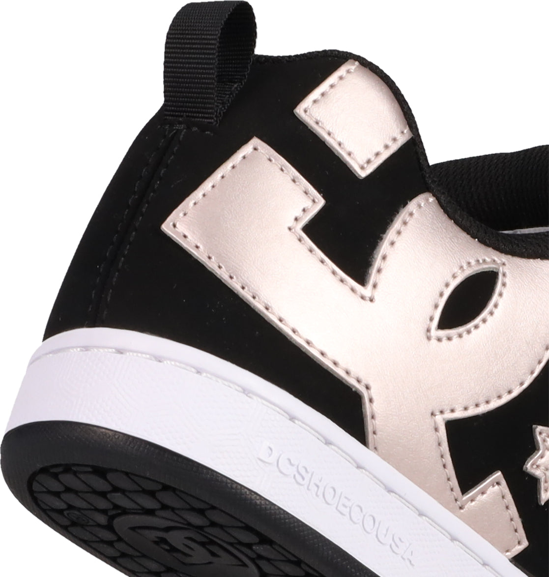 Close-up of the heel on Women's Court Graffik Shoes by DC Shoes, featuring a black puffy silhouette, metallic gold E design, white midsole embossed with DCSHOECOUSA, black pull tab and outsole. The iconic DC logo completes the bold look.