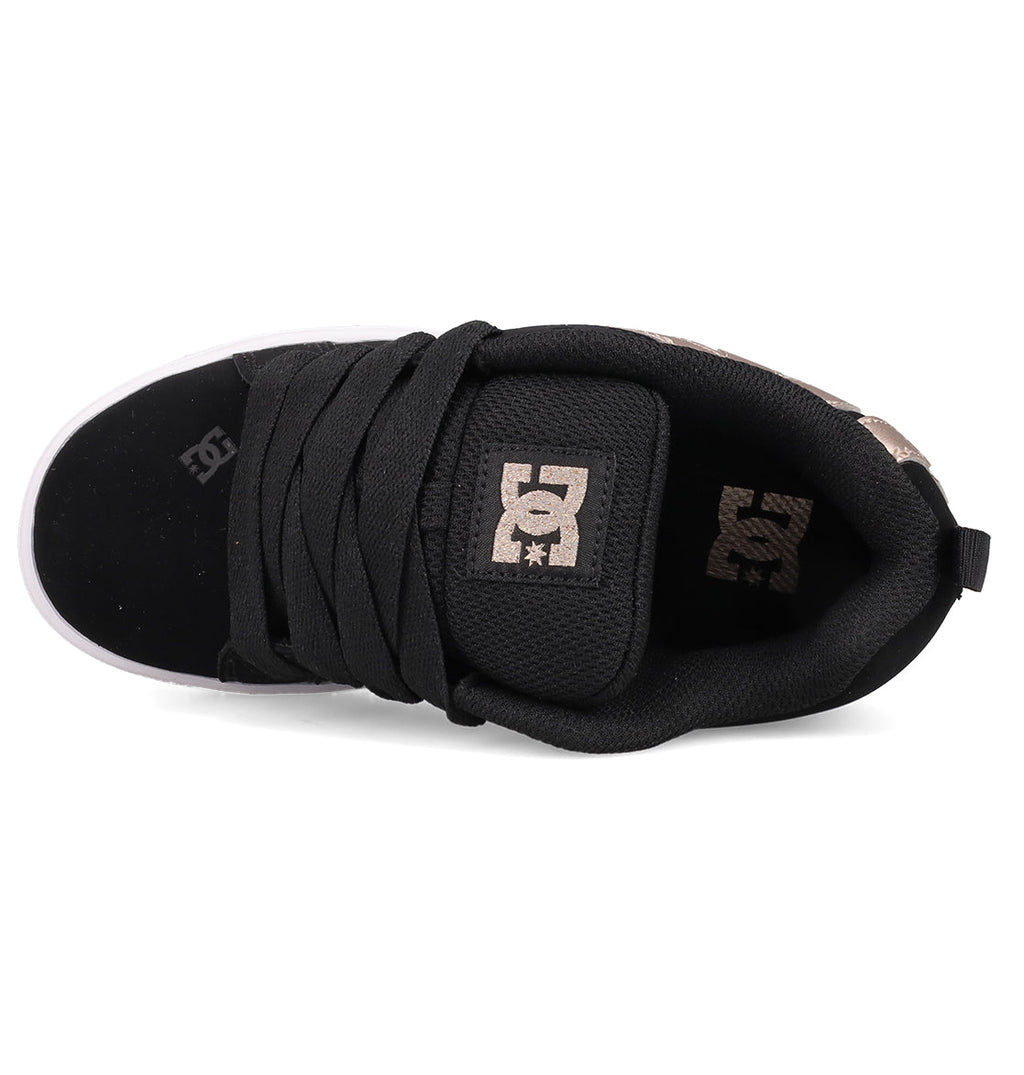 The Kids’ Court Graffik Shoes by DC Shoes are black skate shoes with a classic puffy silhouette, thick black laces, a padded tongue showcasing the beige DC logo, and beige logo accents on the mostly black upper.