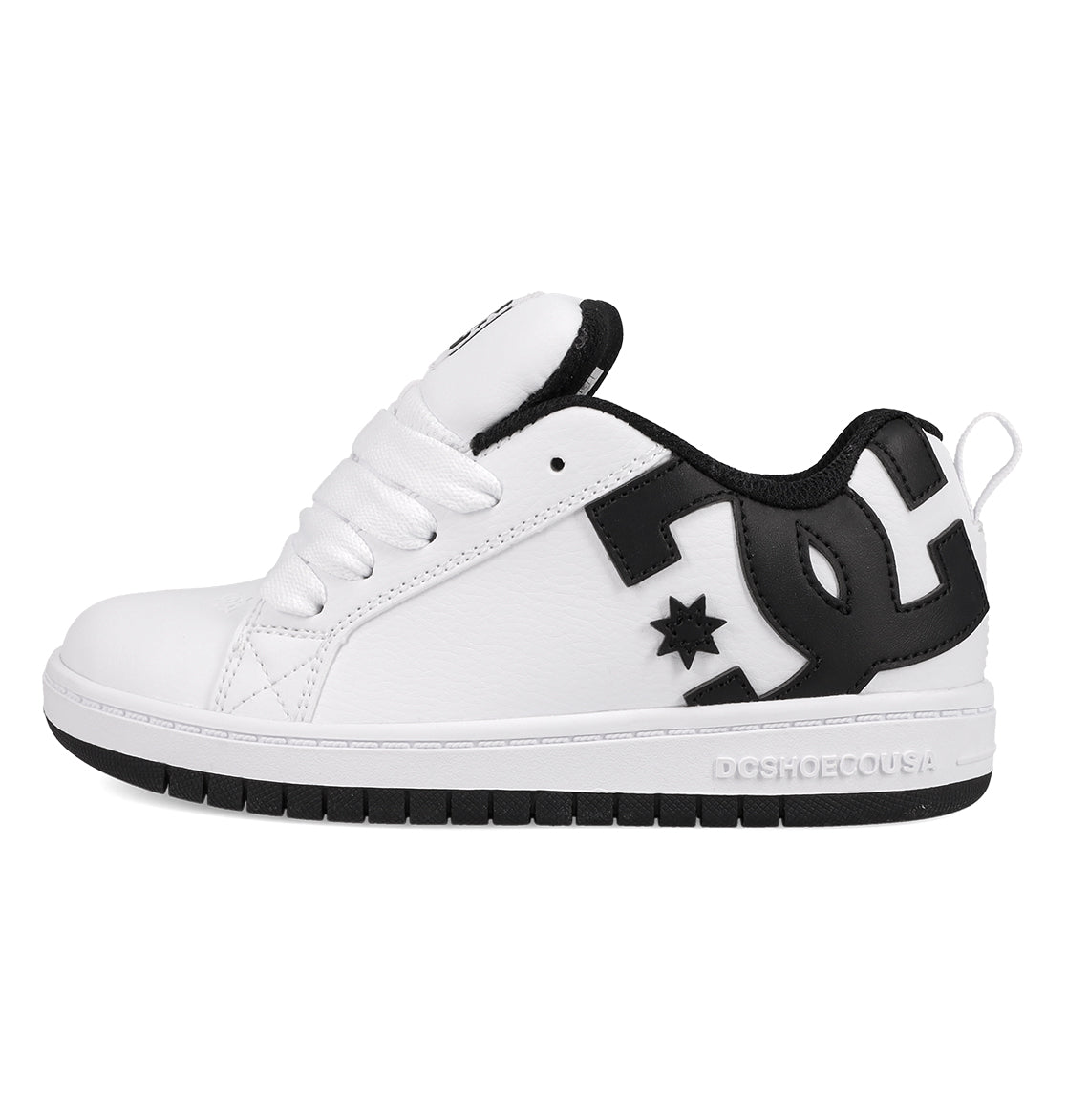 The DC Shoes Kids' Court Graffik Shoes feature a white low-top design with a thick sole, black heel and collar, bold black DC logo on the side, skate-inspired style, white laces, and subtle stitching details.