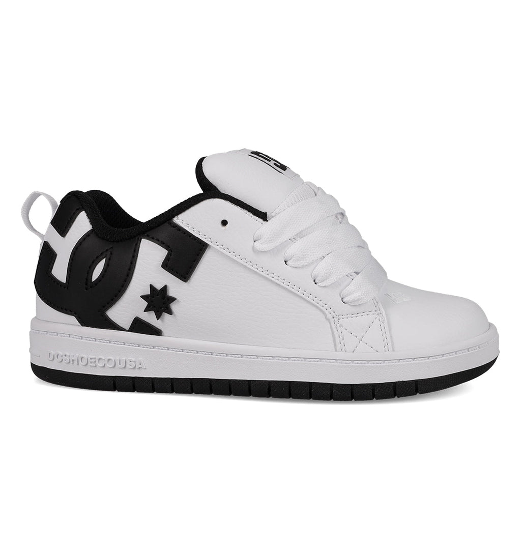 The DC Shoes Kids' Court Graffik Shoes feature a white and black low-top skate style with a thick sole, white laces, black DC logo on the side, and a convenient heel loop—ideal for kids.