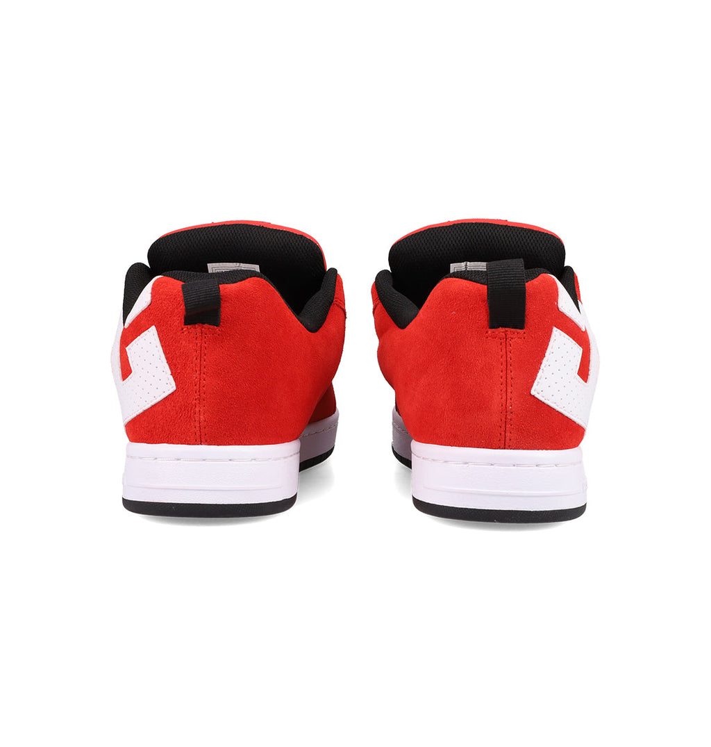 The Men's Court Graffik SE Shoes by DC Shoes feature a red suede upper, puffy silhouette, white soles, and white geometric side designs, displayed from the back on a plain white background.