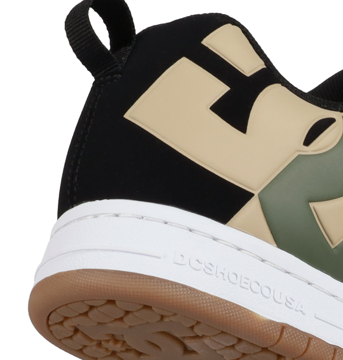 Close-up of the heel of the DC Shoes Men’s Court Graffik Special Edition Shoes, showcasing a black, beige, and green colorway with the iconic puffy silhouette, a white midsole embossed with “DCSHOECOUSA,” and a tan rubber outsole.