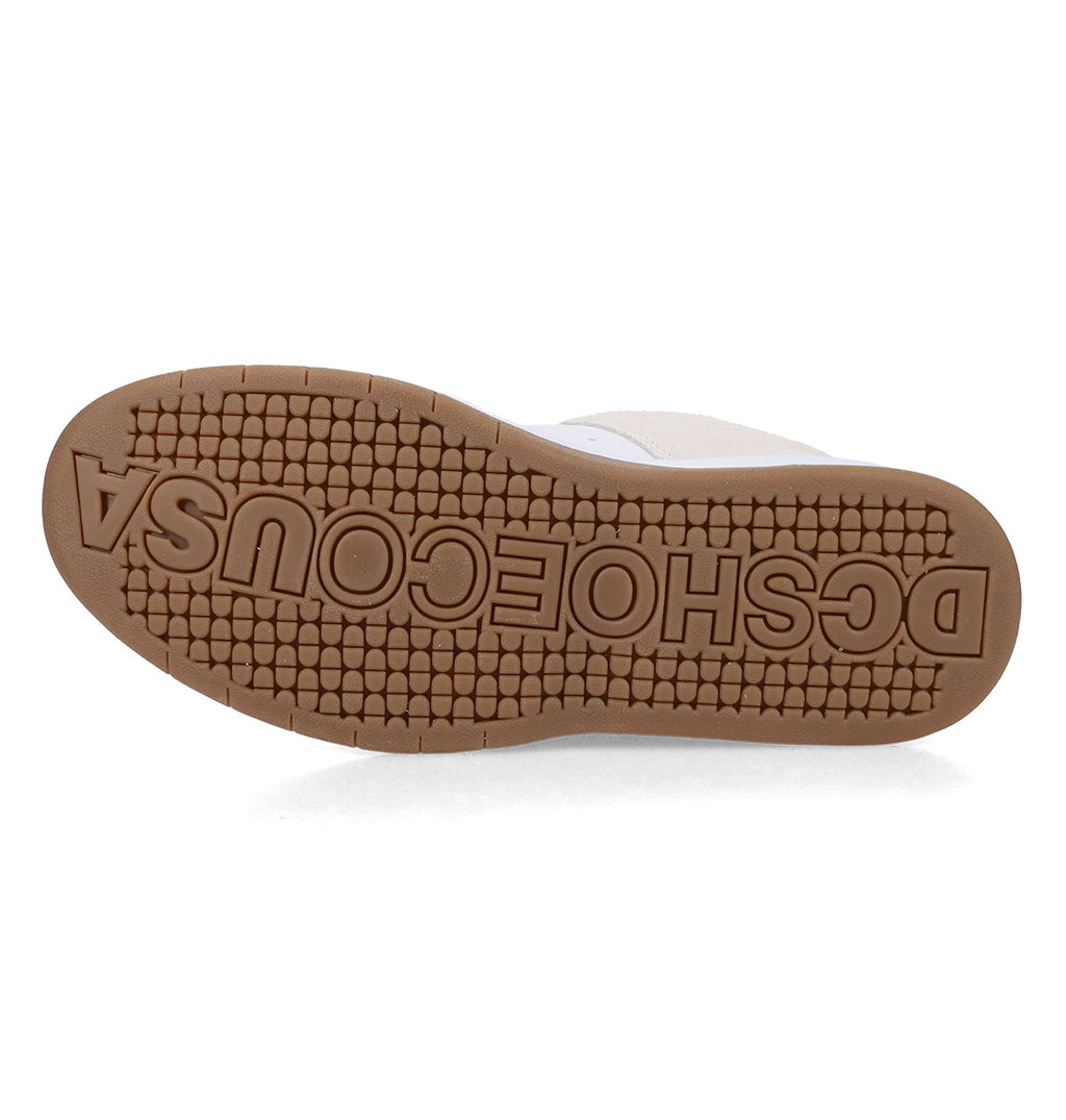 The bottom sole of the Men’s Lynx Shoes by DC Shoes features a tan rubber tread, exemplifying the reliable durability associated with DC skate footwear. The word DCSHOECOUSA is prominently embossed in large, raised letters across the sole.