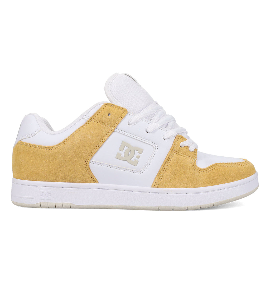 The DC Shoes Men’s Manteca 4 features a white and light tan colorway with suede accents, white laces, and a durable white rubber sole. Shown in side profile against a plain white background, this performance-focused shoe combines everyday style with lasting durability.