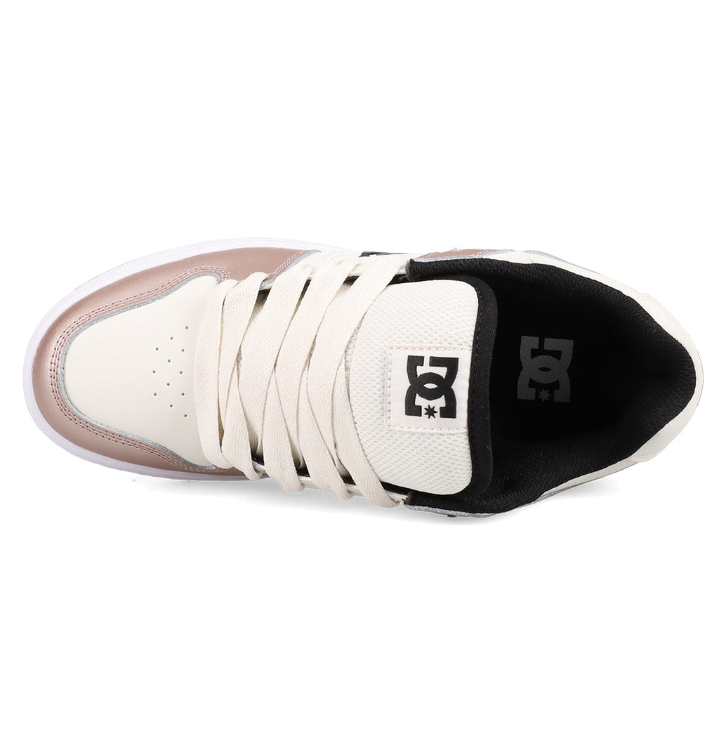 Top view of the Women's Manteca 4 Shoes by DC Shoes in beige and light pink, featuring cream laces, a black interior, and a tongue with the black and white DC Shoes logo for stylish comfort.