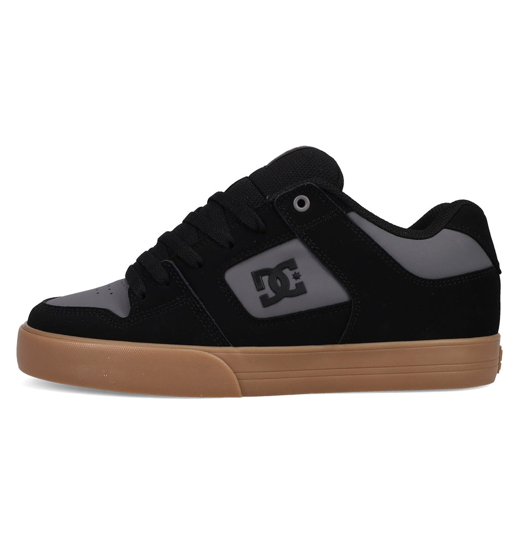 The Men's Pure Shoes by DC Shoes feature a black and gray design, gum rubber sole, DC logo on the side panel, and black laces—combining comfort with classic skate style.
