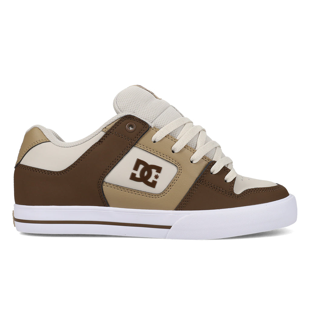 The Men’s Pure Shoes by DC Shoes feature a brown and beige upper with a white sole, beige laces, and the signature DC logo on the side. Photographed from the side against a white background, these versatile skate shoes showcase classic DC style.