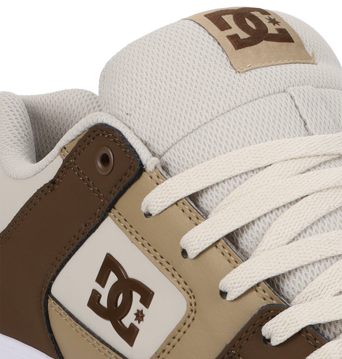 Close-up of the Men’s Pure Shoes by DC Shoes in beige and brown, highlighting the DC logo on the side panel and tongue, white laces, and textured fabric around the ankle—an excellent choice for anyone looking for comfortable men’s footwear with versatile style.