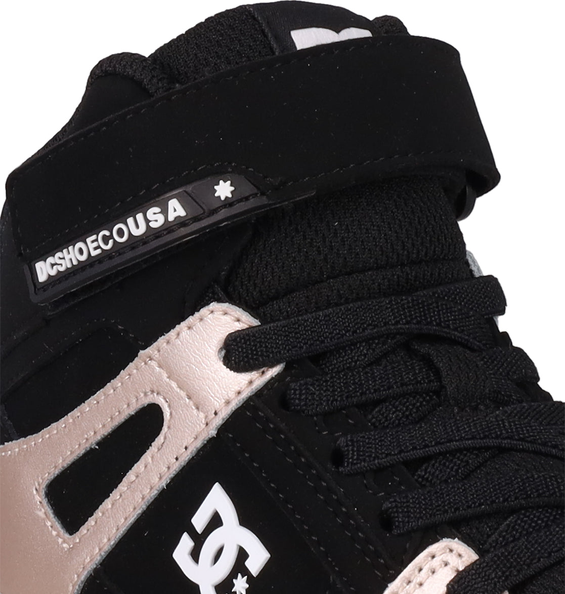 Close-up of DC Shoes Kids' Pure Hi Top EV, a black and beige high-top sneaker featuring laces, Velcro strap, vulcanized outsole, and DCSHOECOUSA branding with the signature DC logo on the side.