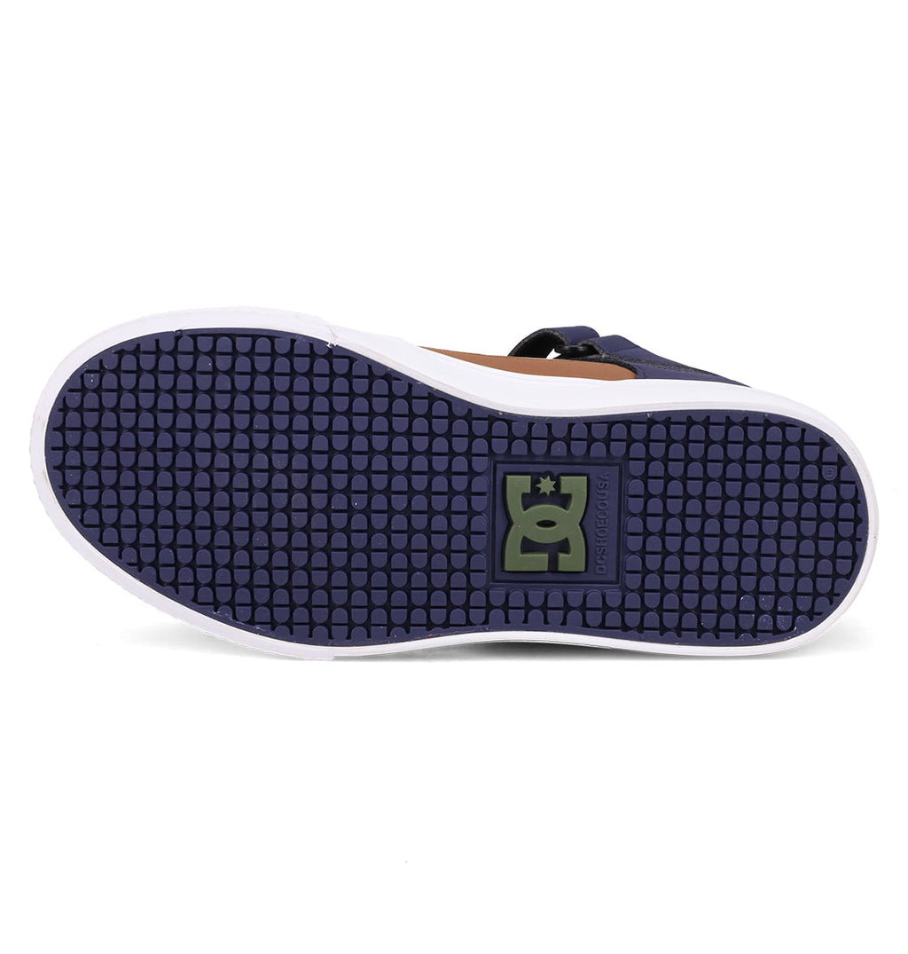 The image shows the sole of the DC Shoes Kids' Pure Hi Top EV, featuring a dark purple textured grip, a green rectangular logo with a stylized G and crown at the center, and a white outer edge.