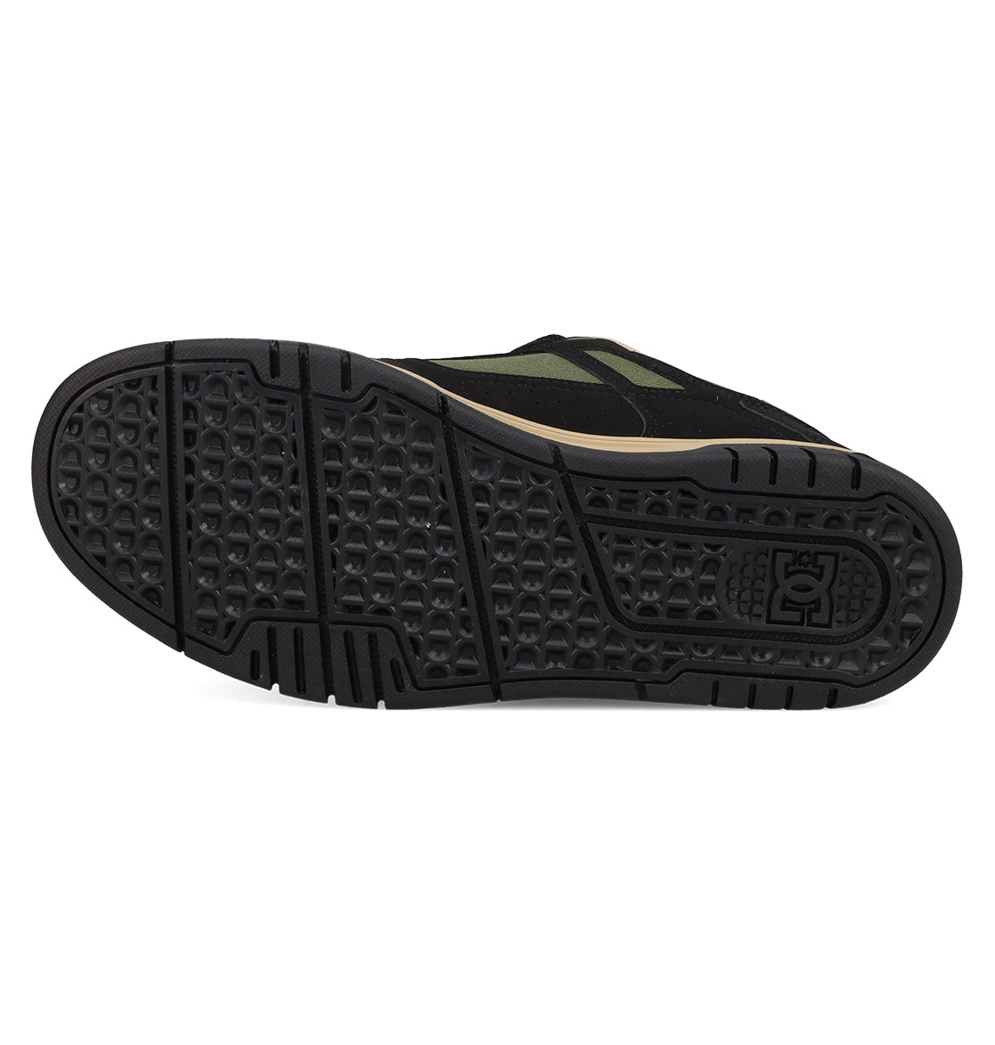 The image shows the black rubber sole of the Men's Stag Shoes by DC Shoes, featuring a textured hexagonal tread and an embossed logo near the heel, emphasizing its durable cupsole designed for skate culture.