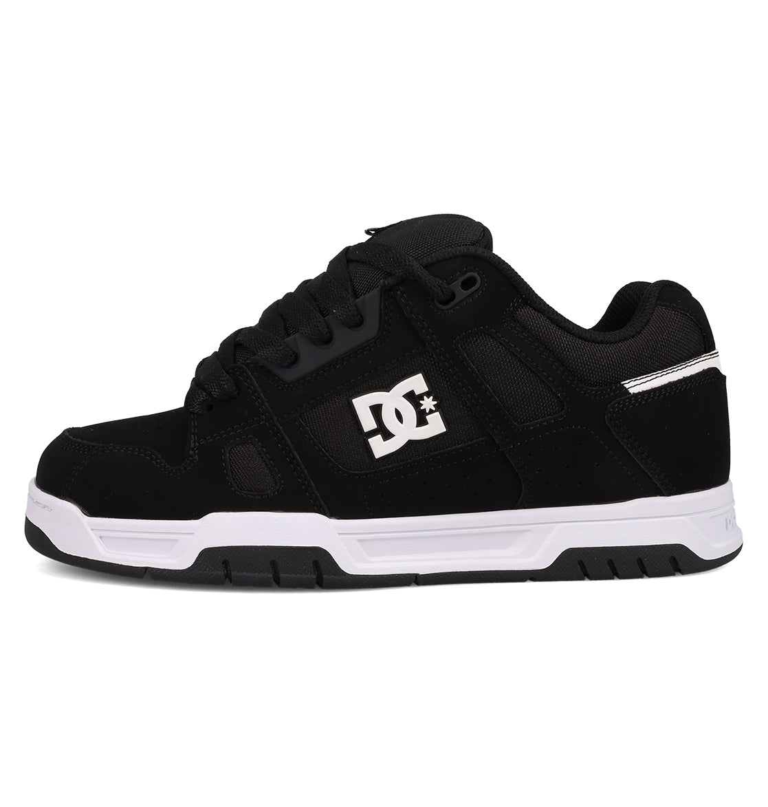 The DC Shoes Men's Stag features a black low-top design with black laces, subtle mesh and suede details, white sole, cupsole construction, and a white DC logo on the side—shown from the left.