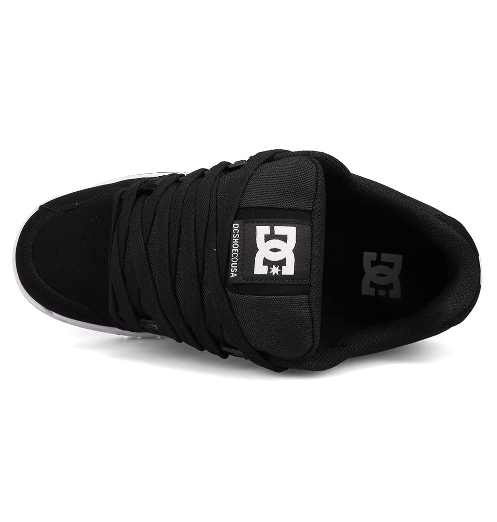 Top view of DC Shoes Men's Stag with thick black laces, a white logo on the tongue, signature cupsole construction, padded collar, and a partially visible white outsole at the toe.