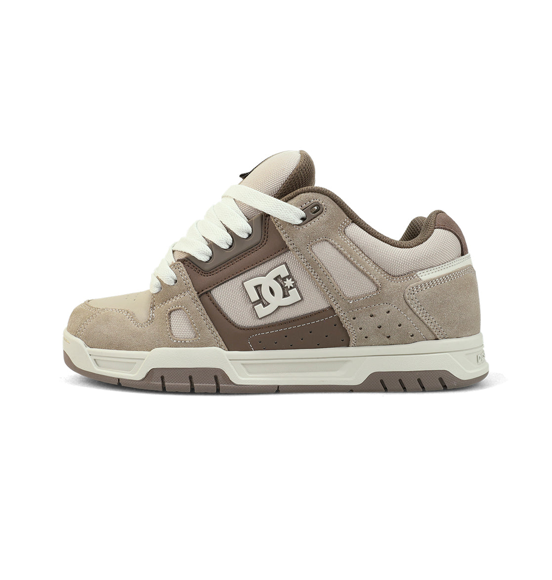 The Men's Stag Shoes by DC Shoes feature a beige and brown suede and mesh design with white laces, a white sole, the DC logo on the side, a durable cupsole, oversized puff tongue, and chunky style for comfort and flair.