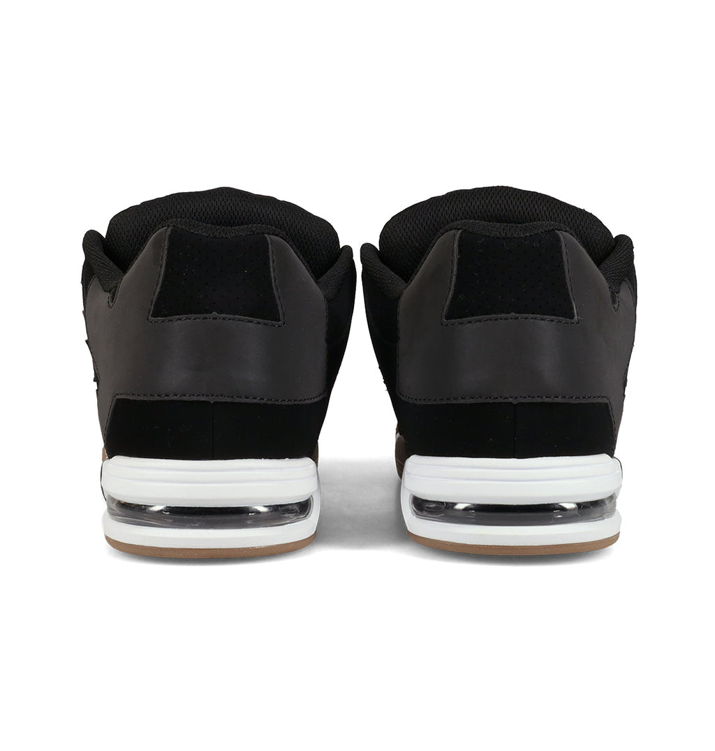 A pair of DC Shoes Men’s Command Shoes in black, viewed from the back, featuring white midsoles with signature cushioning and gum outsoles that capture the classic DC bulk inspired by the Command line.