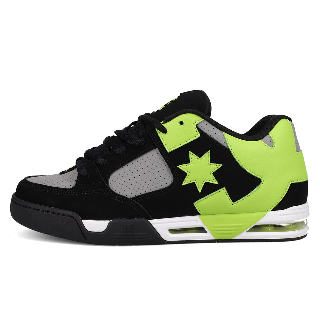 The Men's DC Command Shoes by DC Shoes are black, gray, and neon green low-tops with a perforated toe box, thick sole, star side design, street-ready look, visible heel air cushion, and thick black laces.