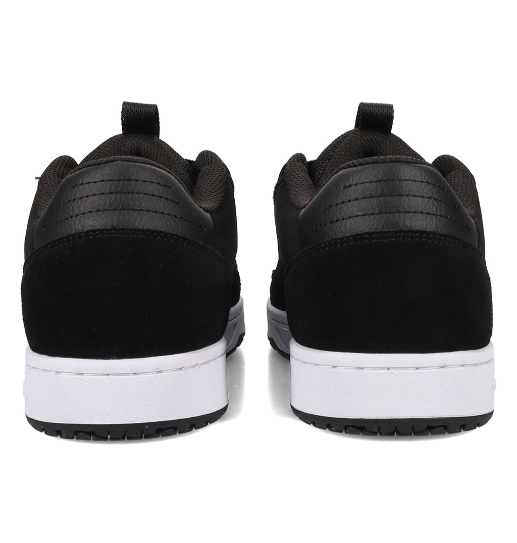 Rear view of the Men’s Astrix Shoes by DC Shoes in black, featuring low-top design and white soles, placed side by side on a white background—ideal for street skateboarding and providing excellent board control.