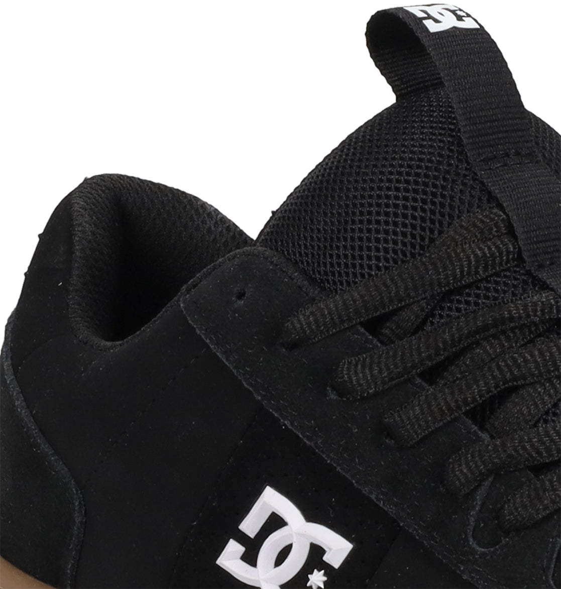 Close-up of a black DC Shoes Men’s Astrix Shoe showing the side logo, black laces, mesh tongue, and a pull tab with the DC logo. Designed for street skateboarding, this shoe emphasizes board control. Only part of the shoe is visible against a white background.