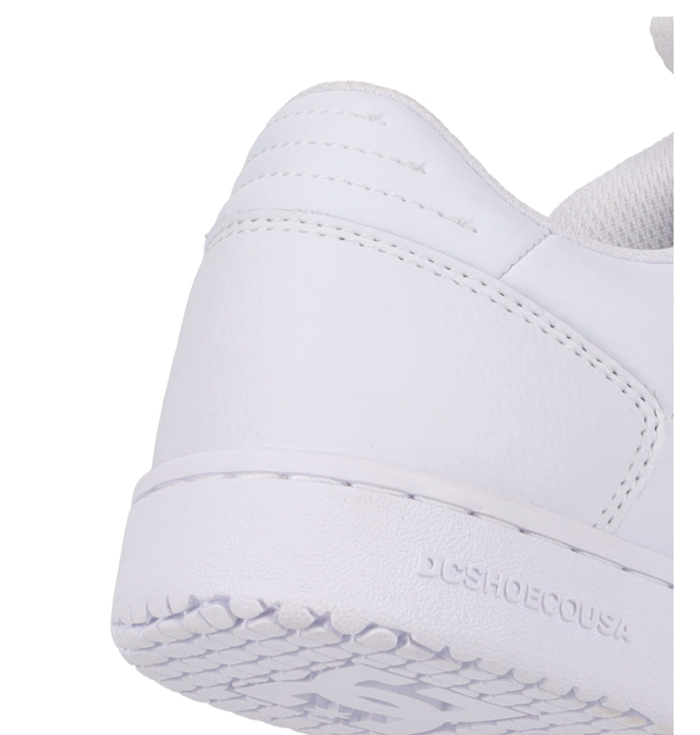 Close-up of the heel and sole of the Women’s Astrix Shoes by DC Shoes, featuring visible stitching and DCSHOECOUSA embossed on the side, designed for street skateboarding and enhanced board control.