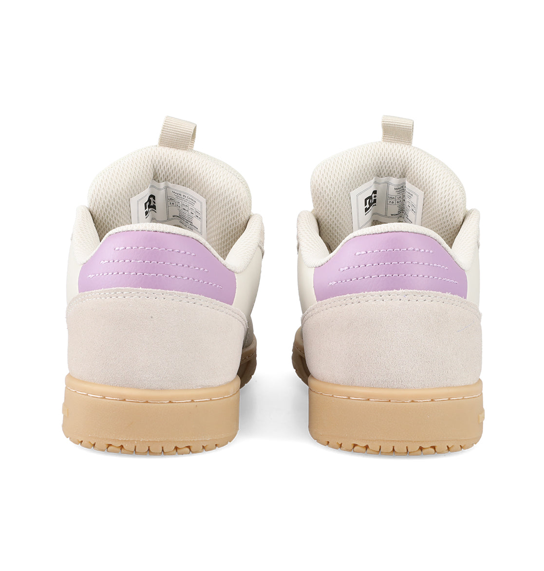 The Women’s Astrix Shoes by DC Shoes are shown from the back, showcasing cream-colored uppers, light purple heel accents, beige suede details, and tan rubber soles—engineered to provide board control ideal for street skateboarding.