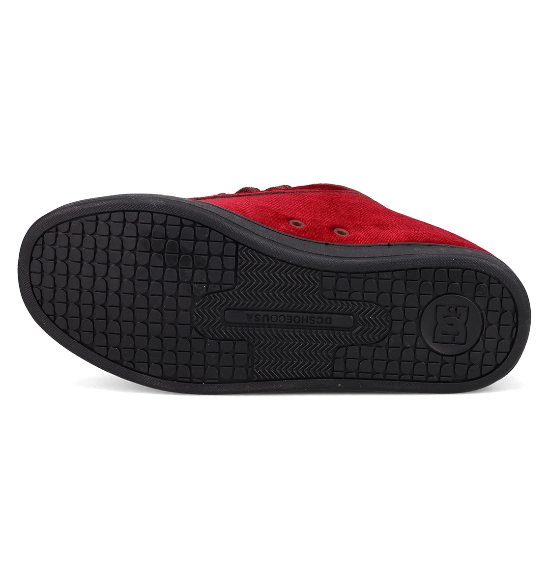 The Women's Court Graffik LE Shoes by DC Shoes are featured from the bottom, highlighting a black textured rubber sole with the DC SHOES logo embossed near the heel.