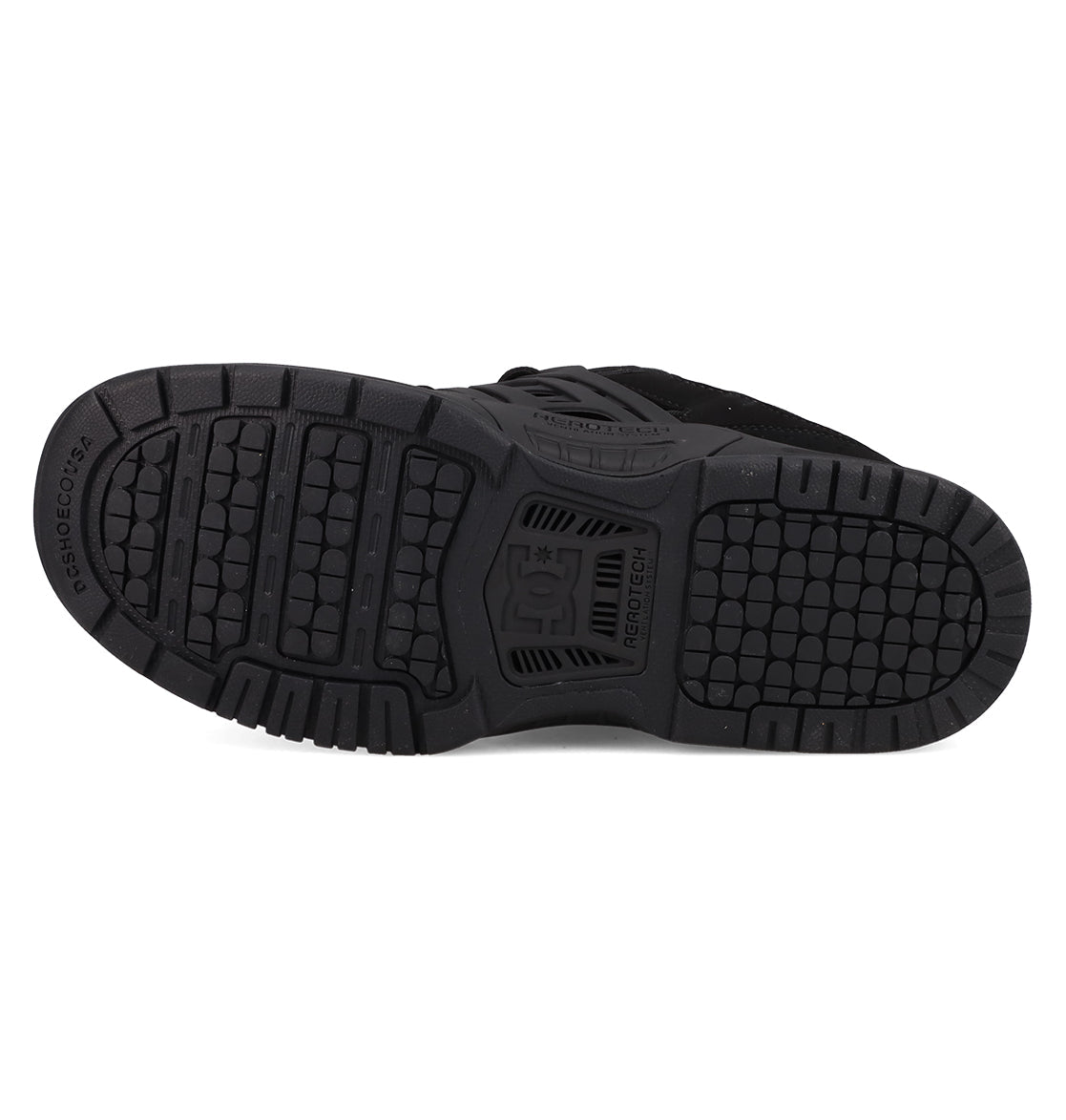 The image shows the black rubber sole of the Men's AT-2 Shoes by DC Shoes, featuring a textured tread pattern with the DC logo in the center and AEROTECH ventilation for breathability.