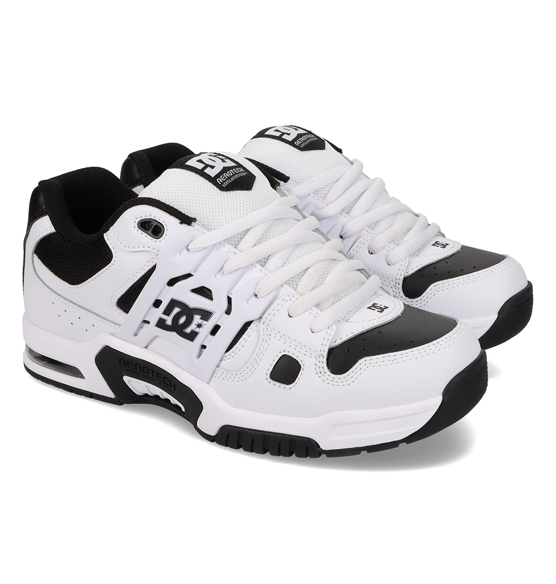 A pair of Men’s AT-2 Shoes by DC Shoes featuring black and white mesh and leather accents, lace-up design, a supportive TPU cage for enhanced stability, and a thick sole.