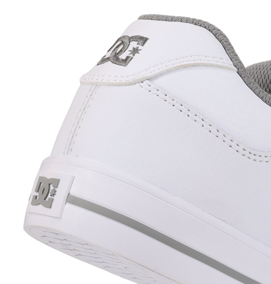 Close-up of the heel of the Women’s Pure Shoes by DC Shoes in white with gray accents, showcasing the signature DC Shoes logo in gray on both the heel tab and back of the sole. Engineered for impact absorption, this style also provides lightweight cushioning for all-day comfort.