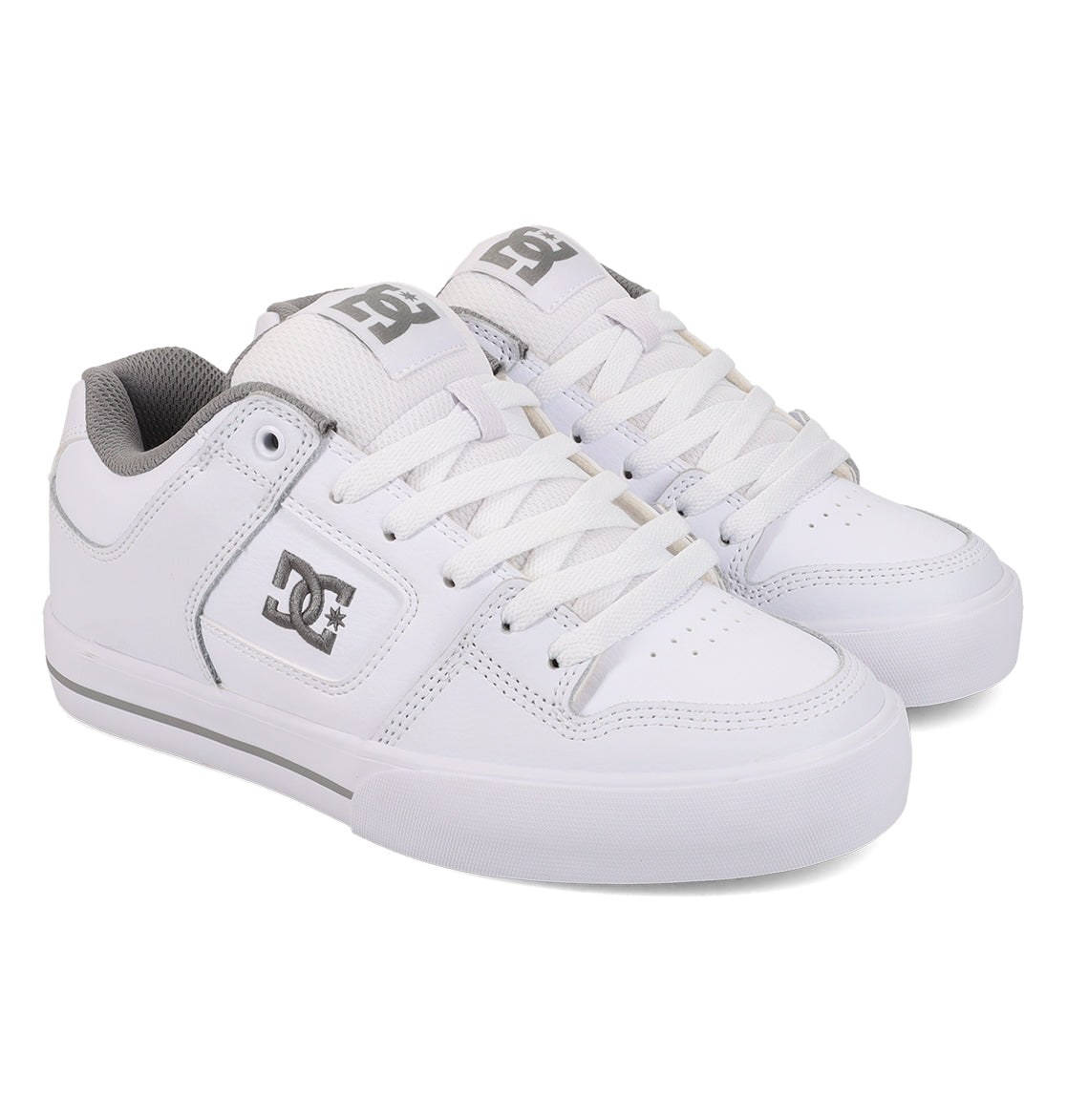 A pair of Women’s Pure Shoes by DC Shoes, featuring a white design with gray accents, white laces, and a gray DC logo on the side. These skate shoes offer lightweight cushioning for enhanced impact absorption and are displayed against a white background.
