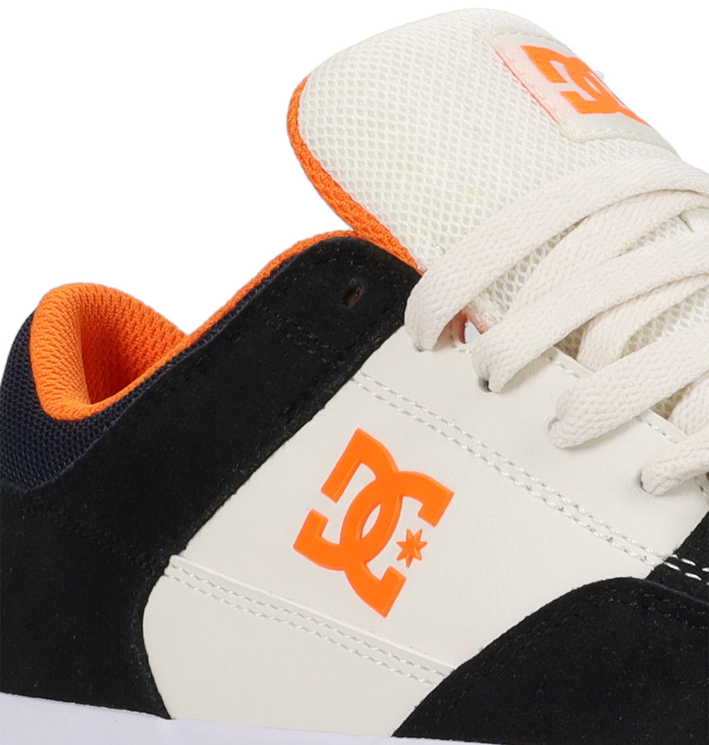 Here’s a revised sentence using your product data: Close-up of the DC Shoes Men’s Onyx Skate Shoes, showcasing a minimal silhouette in black, white, and orange. This everyday go-to sneaker features a white lace, striking orange logo and interior, mesh tongue for breathability, and durable vulc construction.
