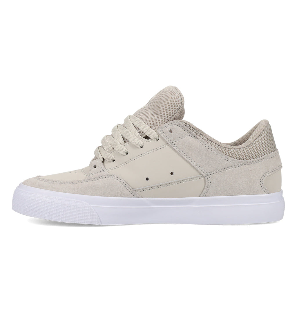 The DC Shoes Men’s Onyx Skate Shoe is shown in a left side profile view on a white background—featuring a beige low-top design with suede and mesh panels, matching beige laces, and a white rubber sole for a minimal silhouette that makes it the perfect everyday go-to.