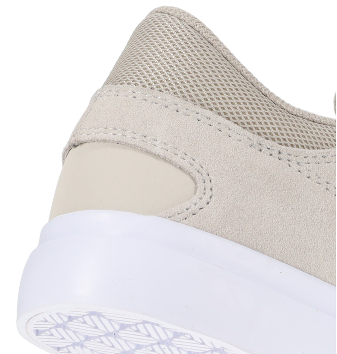 Close-up of the back portion of the DC Shoes Men’s Onyx Skate Shoes in beige, showcasing a minimal silhouette with suede and mesh textures, detailed stitching, a white vulcanized sole, and designed as an everyday go-to sneaker.