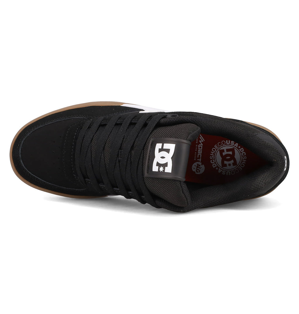 Top view of the Men’s Fractal S Shoes by DC Shoes featuring black laces, a white DC Shoes logo on the tongue, a brown outsole, and an insole with DC Shoes branding in white and red for a stylish, performance-driven fit.