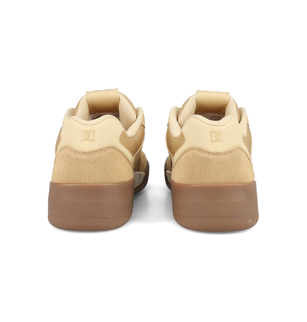The DC Shoes Men's Fractal S sneakers, in tan and brown suede, feature rubber soles and embossed heel logos, blending street-ready style with the comfort-focused design of the Fractal line.