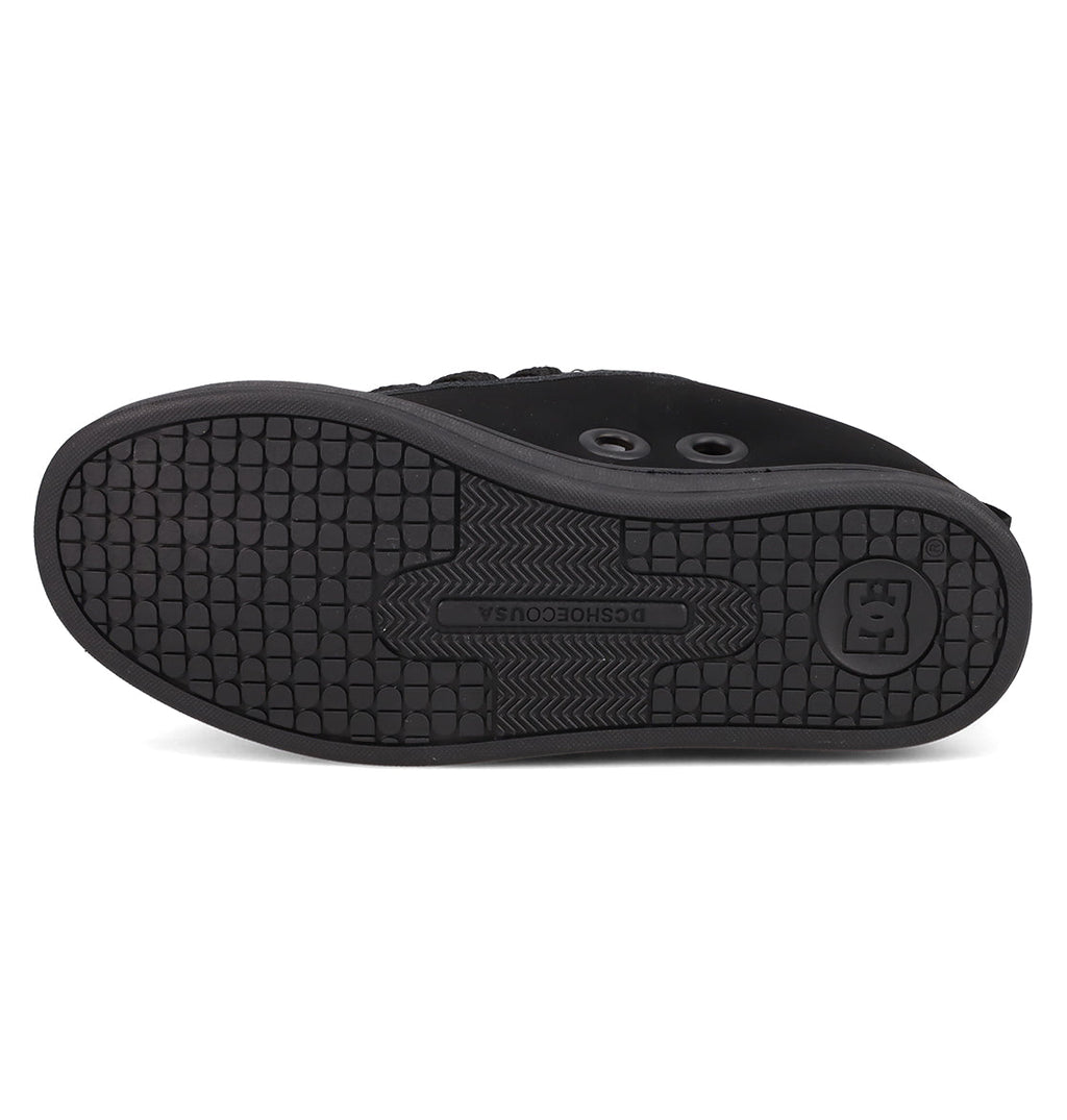 The image shows the black rubber sole of DC Shoes’ Women's Court Graffik Puff Shoes, featuring a textured tread, circular accents, and DCSHOECOUSA branding—key details for these statement shoes with their signature puffy silhouette.